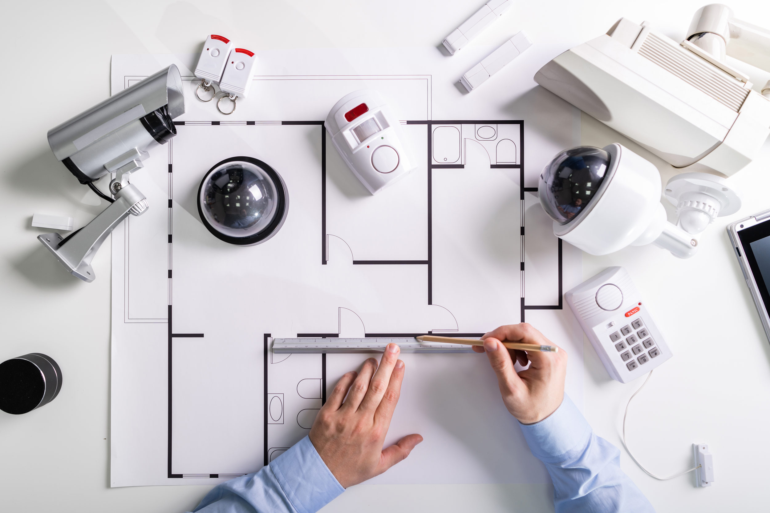 Close-up Of An Architect’s Hand Drawing Blueprint